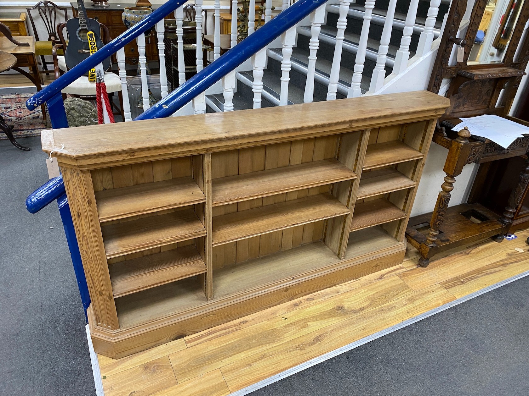 A Victorian style pine open bookcase, width 188cm, depth 25cm, height 102cm